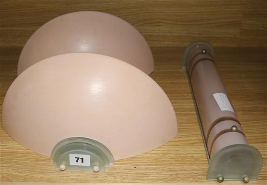 A pair of Art Deco uplighter wall lights in metal and perspex and an Odeon style wall light